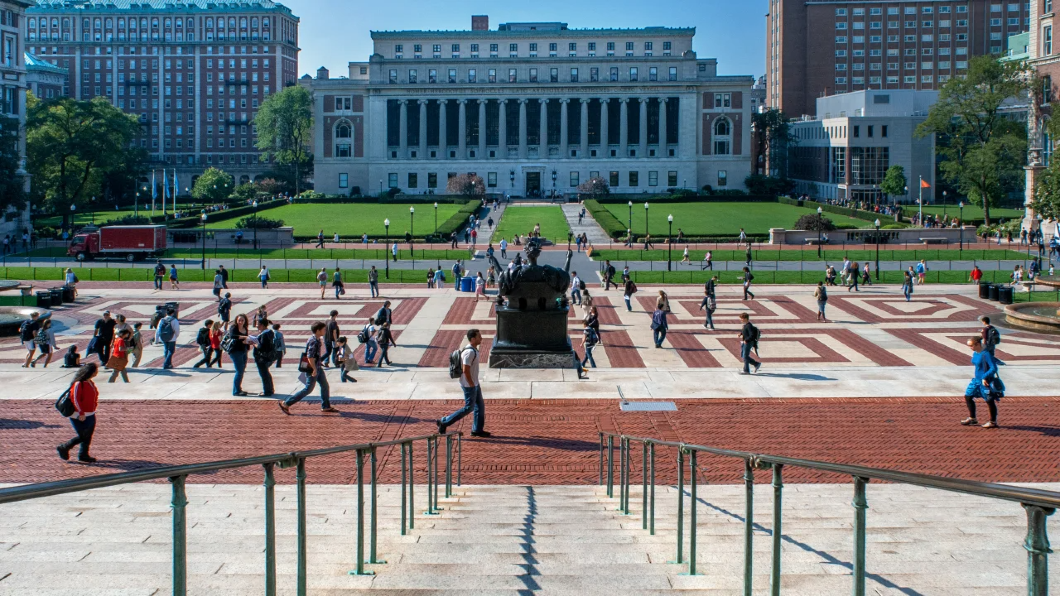 Wide Shot of College Walk while people walk across the campus of Columbia University